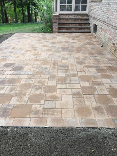 newly installed neutral color paver patio